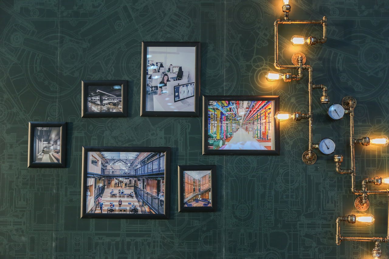 About Industrial style wall art with vintage pipe lighting on a green textured wall adds a unique touch.