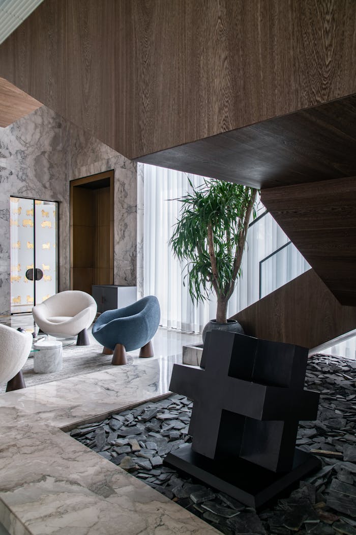 Mastering the First Impression: Your intriguing post title goes here Stylish living space featuring contemporary furniture and marble textures.